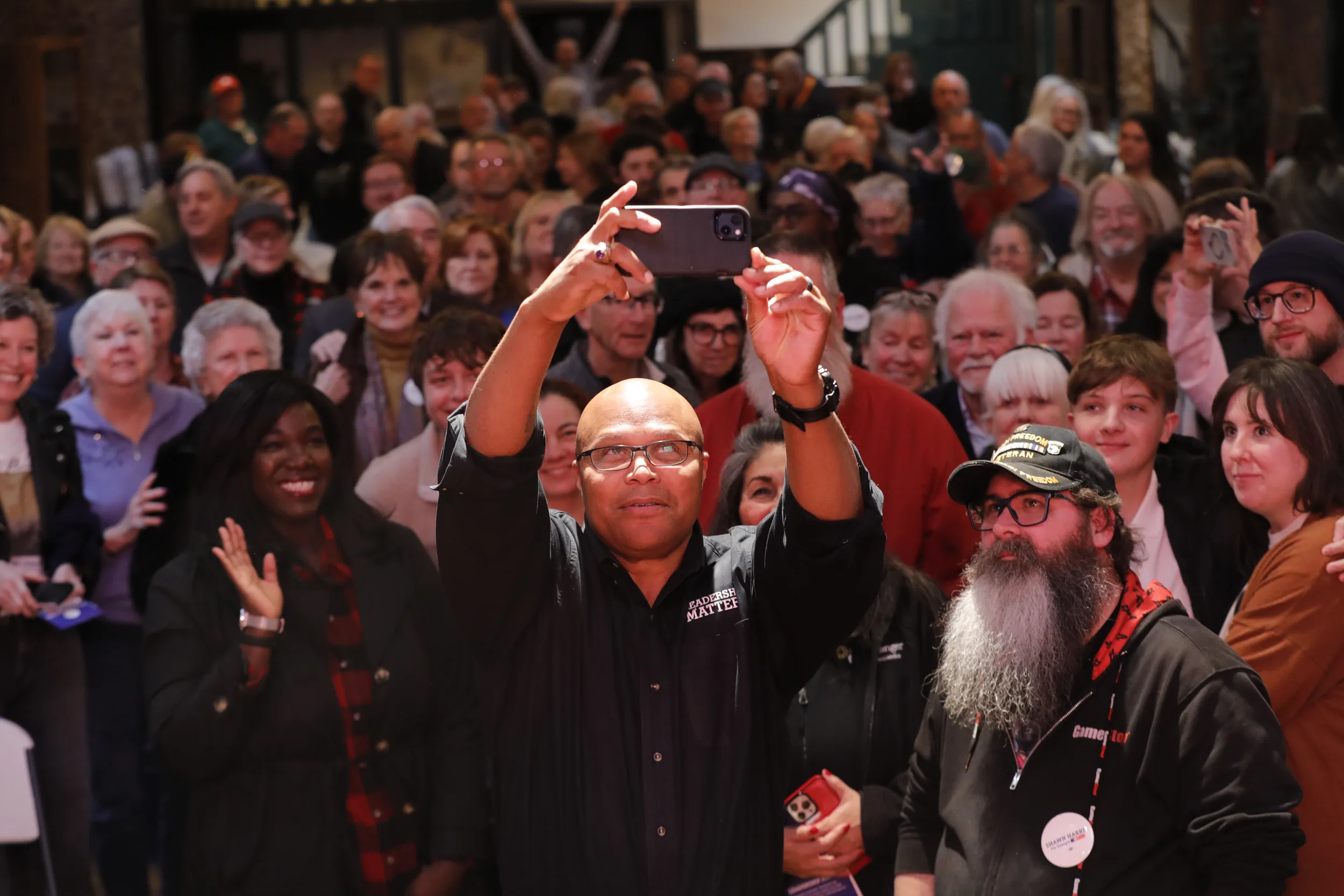 Shawn Harris taking a selfie with supporters